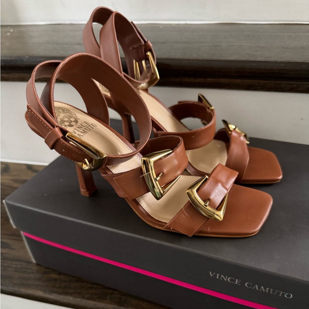 Brown Vince Camuto, high heel sandals with buckle detail.